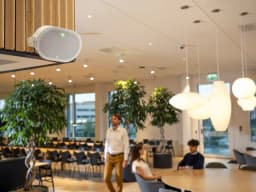 AXIS C1111-E from AXIS COMMUNICATIONS - on wall in canteen